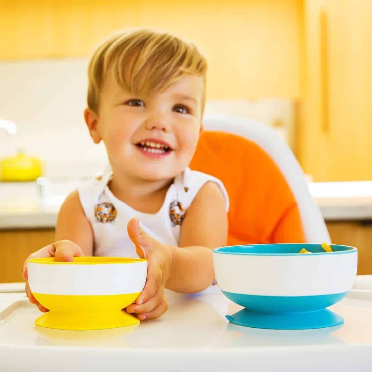 Children learning to feed themselves