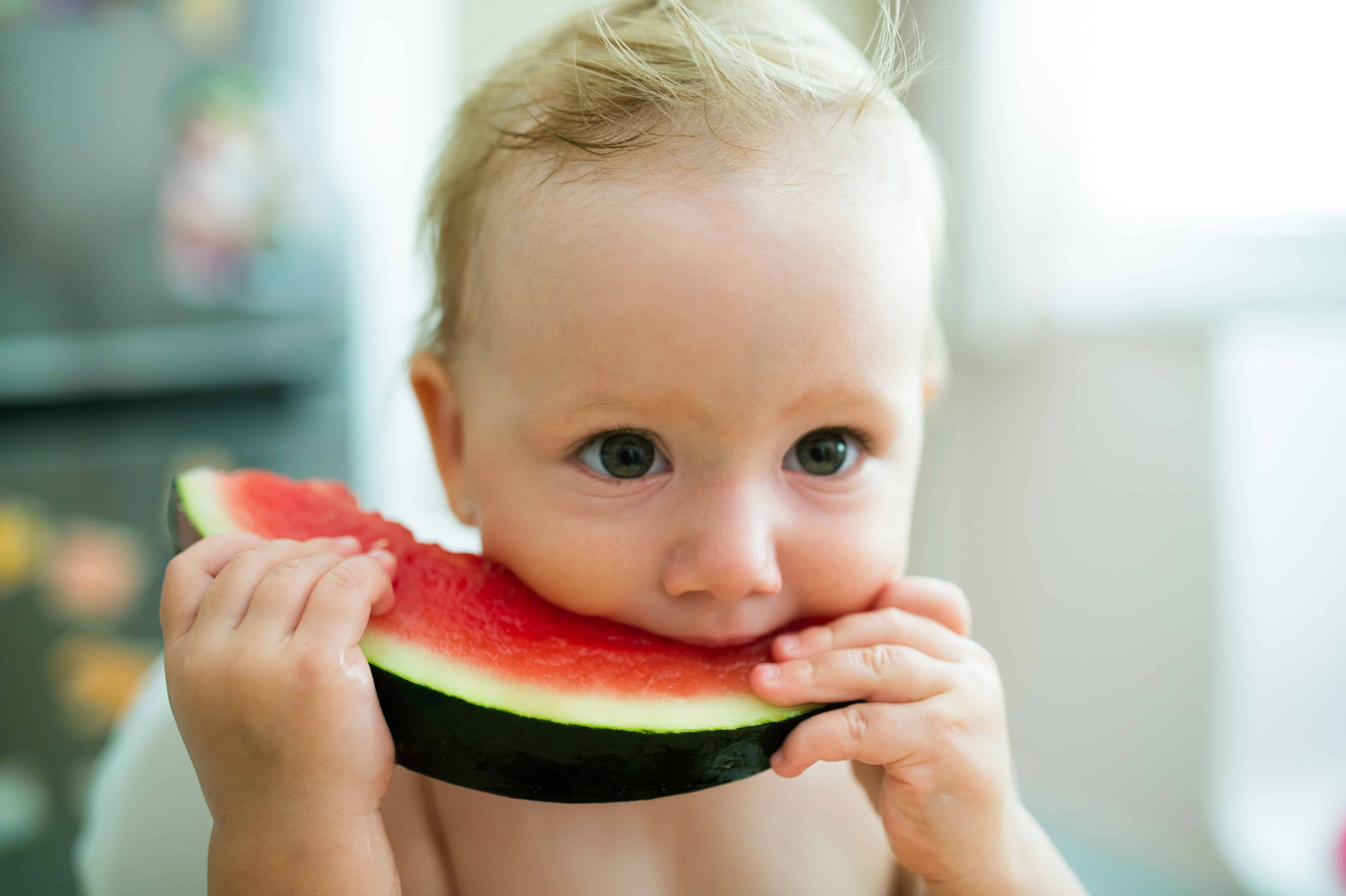 baby eating banana