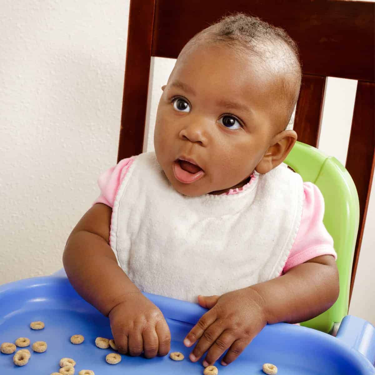 Parents are often wondering, “When can babies eat cheerios?” Or, puffs, toast, cheese, watermelon, and banana. Learn when so you can feed your baby safely! 