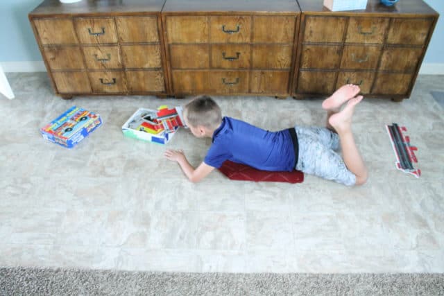 5 Ways to Use a Scooter Board for Sensory Input - Your Kid's Table