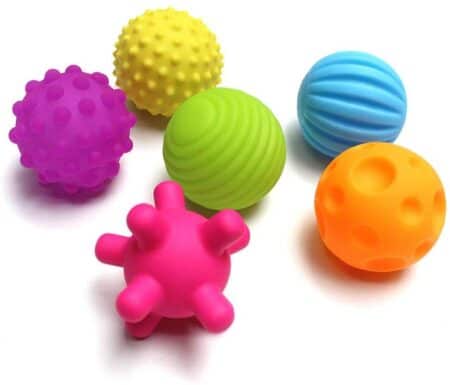 Learn 7 easy ways to use a therapy ball to give your child a ton of sensory input! Plus, get the scoop on what different types of sensory balls are used for. 