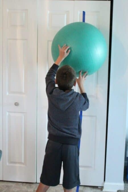 7 Easy Sensory Activities Using a Therapy Ball - Your Kid's Table