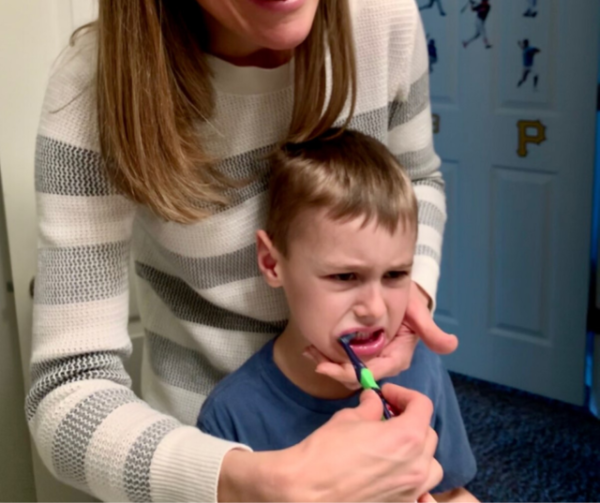 I hear from parents all the time, "Help, my child won't brush her teeth!"  Discover why and get 9 powerful tips to help your child move past the refusals, battles, and tantrums quick. Affiliate links used below. 