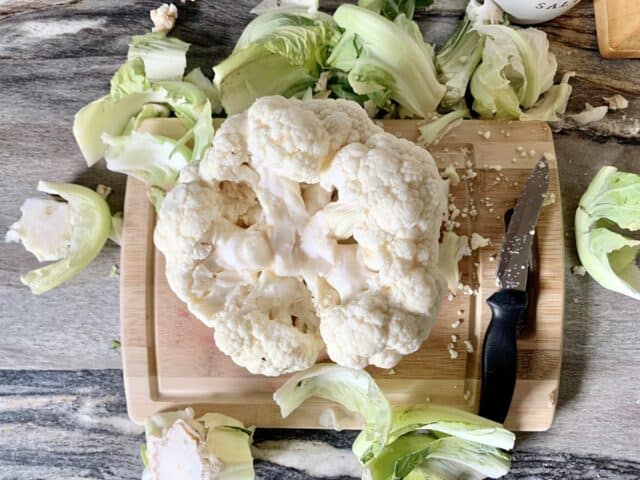 Learn how to make a delicious whole roasted cauliflower recipe that kids, and even picky eaters, will love. It's unique, easy, and only has a few simple ingredients!