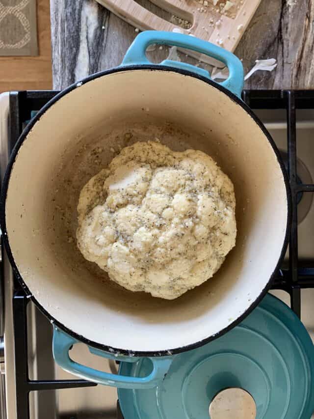 Learn how to make a delicious whole roasted cauliflower recipe that kids, and even picky eaters, will love. It's unique, easy, and only has a few simple ingredients!